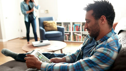 man looking at ipad
