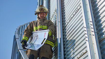 Firefighters with grain rescue tube