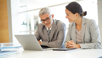 two women discussing paperwork