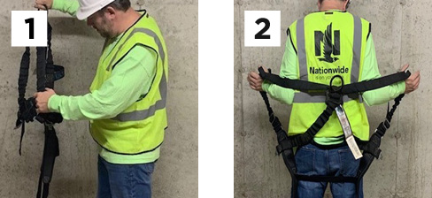 construction worker demonstrating steps 1 and 2 of wearing a safety harness