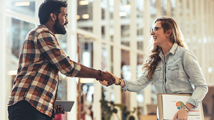 hiring manager shaking hand with a job applicant