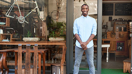 Man standing in front of commercial property