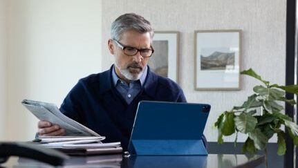 A man using a tablet device