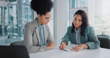 Two business professionals reviewing documents.