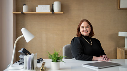 Woman sitting at her desk