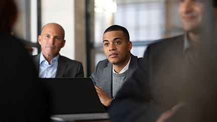several employees in a conference room
