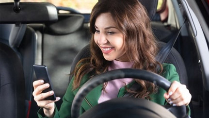 driver looking at mobile phone