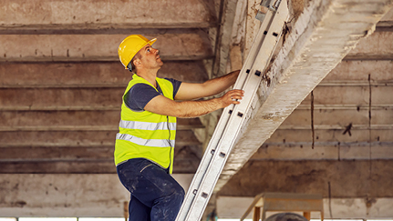 Man safely climbing a ladder