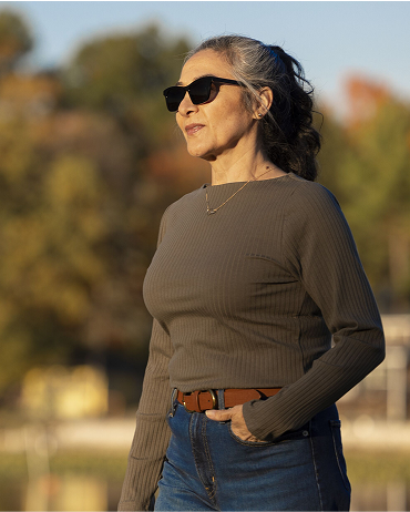 A retired woman taking a walk outside