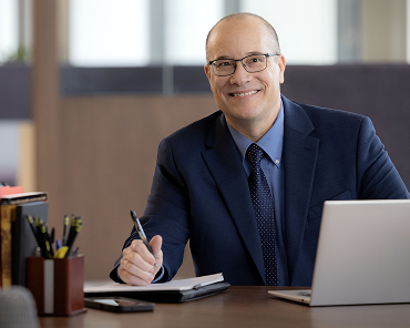 Nationwide Underwriting Specialist Frank Car works on his laptop at Nationwide headquarters.
