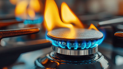 gas burner with flame in commercial kitchen