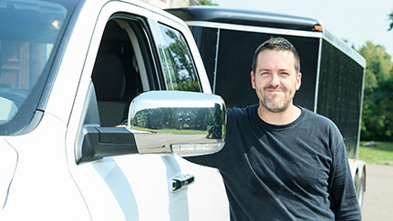 driver standing by truck
