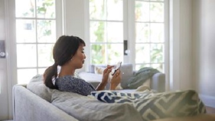 woman on phone in home